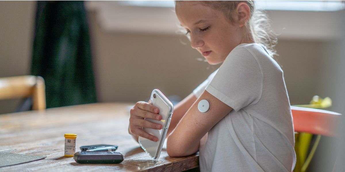 a child checking insulin levels
