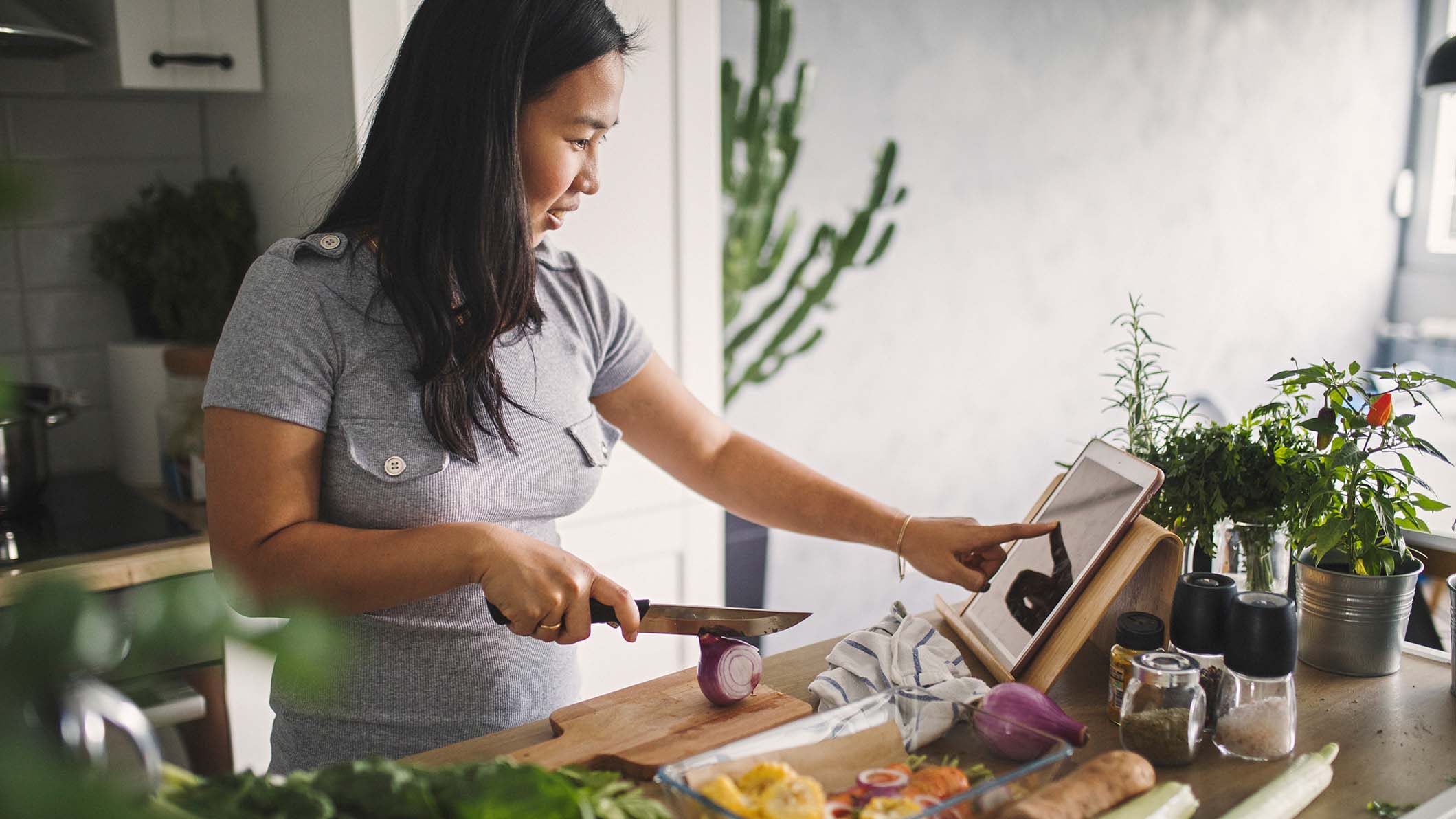 a woman cutting vegetables