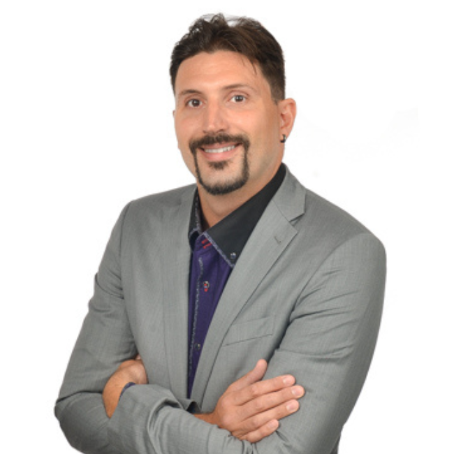 a man in a suit with his arms crossed