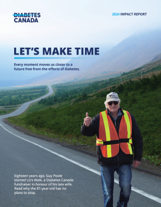 a man wearing a safety vest and standing on a road